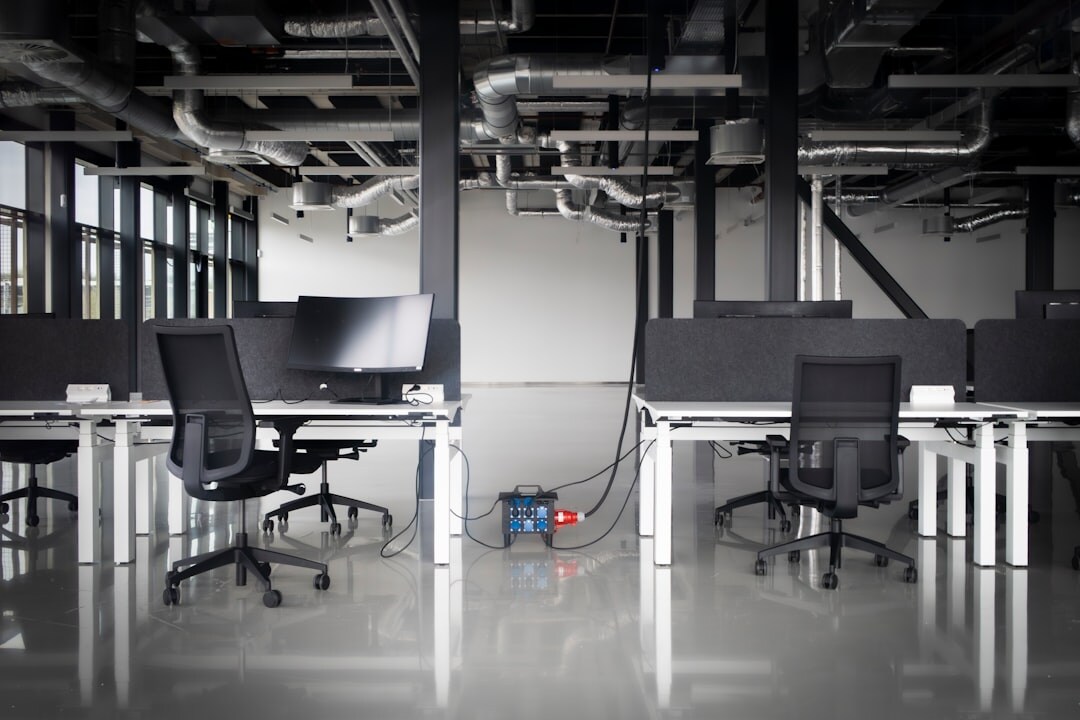 Modern tech startup office with open workspace and computers