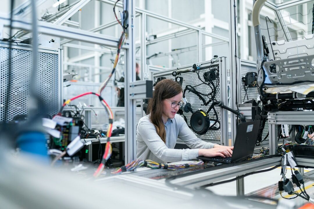 Woman working with advanced automation technology on tablet