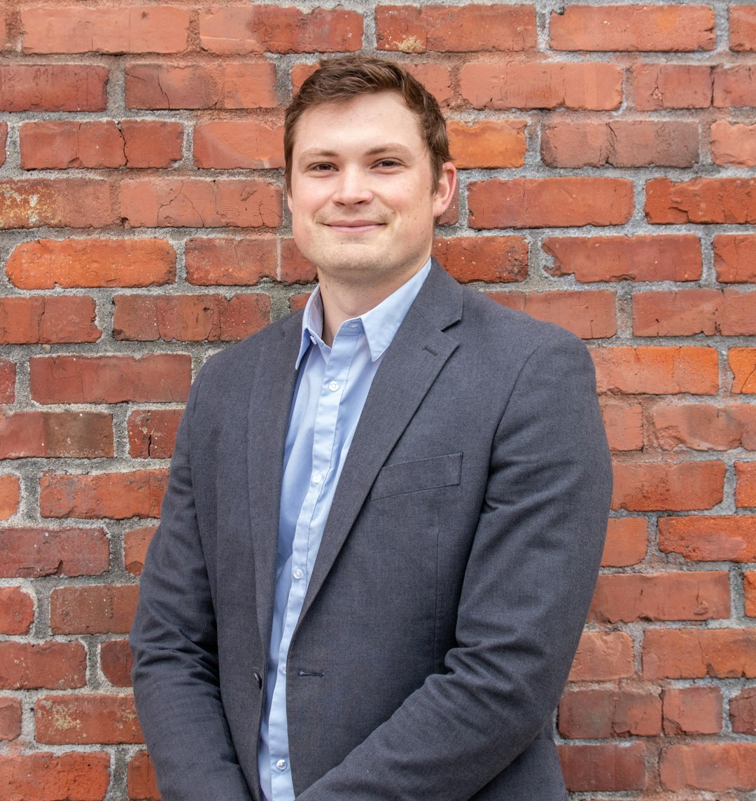 Professional man in business casual smiling confidently